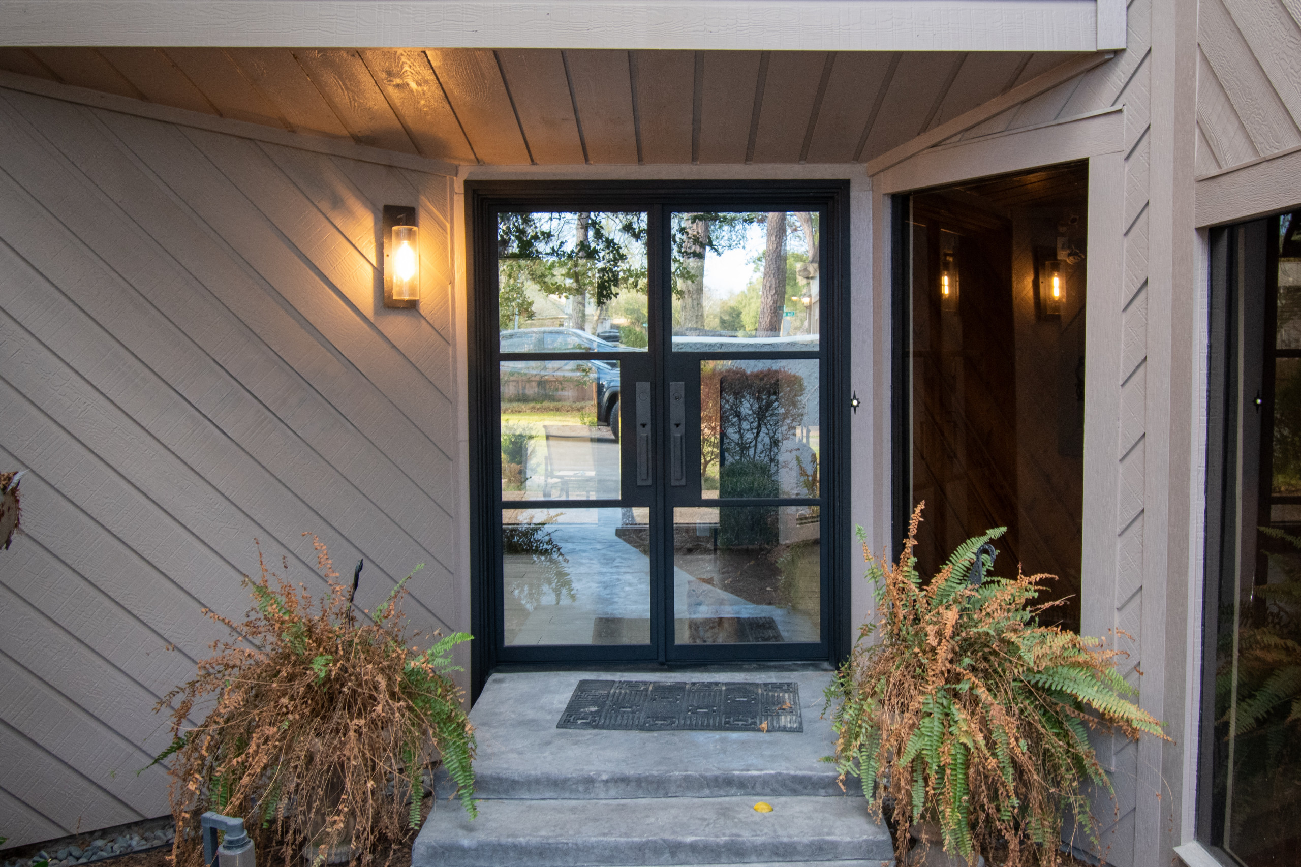 This home first came to us back in 2022 for a full re‑side and repaint of its contemporary exterior. This year, the owner reached out again to see how we could refresh the entryway and boost curb appe