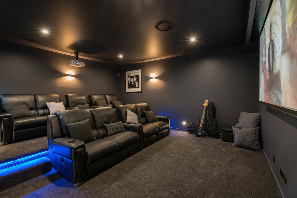 Contemporary enclosed home theatre in Brisbane with grey walls, carpet and grey floor.