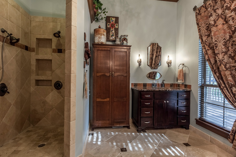 This is an example of a mid-sized traditional master bathroom in Dallas with shaker cabinets, dark wood cabinets, a curbless shower, beige tile, grey walls, ceramic floors, an undermount sink and granite benchtops.
