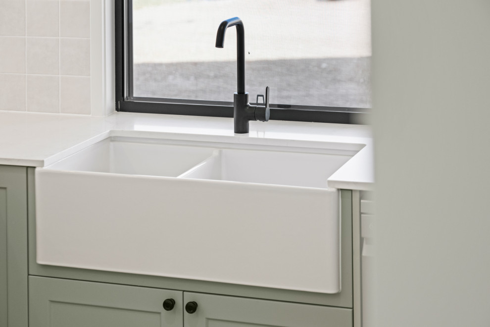 Photo of a traditional laundry room in Other.