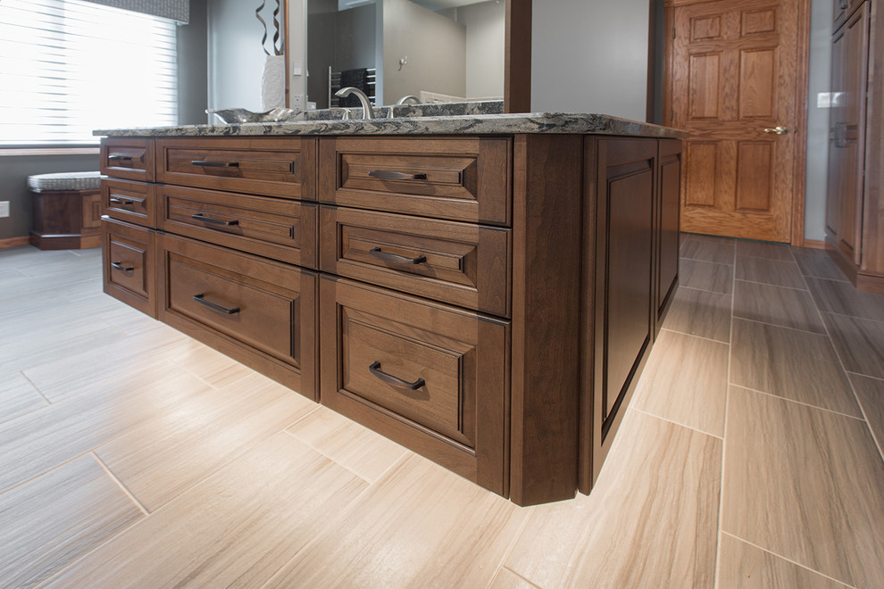 Example of a large transitional master bathroom design