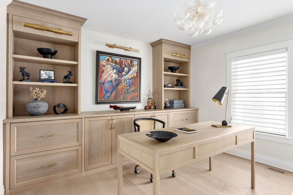 Mid-sized transitional freestanding desk light wood floor and beige floor home office photo with white walls