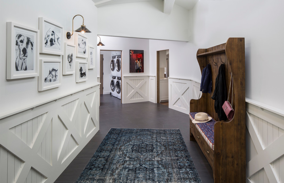 This is an example of a country hallway in Los Angeles with white walls and black floor.