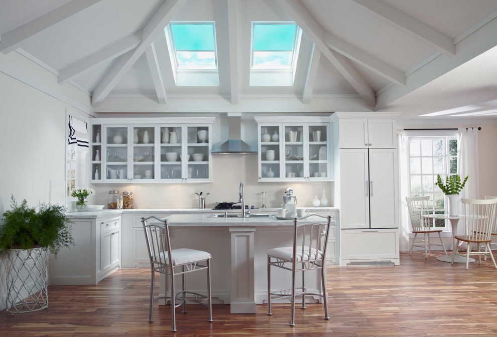 Open concept kitchen - mid-sized transitional l-shaped dark wood floor open concept kitchen idea in Denver with a drop-in sink, shaker cabinets, white cabinets, marble countertops, stainless steel appliances and an island