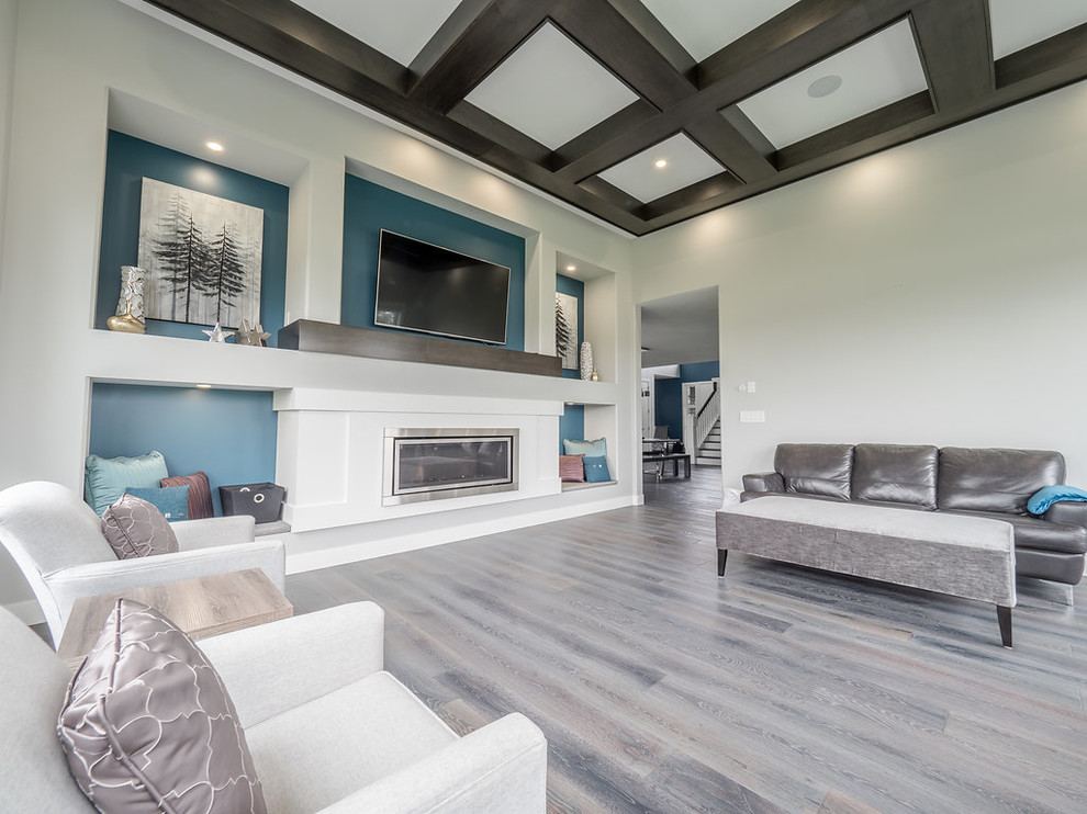 Inspiration for a large contemporary formal enclosed living room in Edmonton with blue walls, medium hardwood floors, a ribbon fireplace, a built-in media wall and multi-coloured floor.