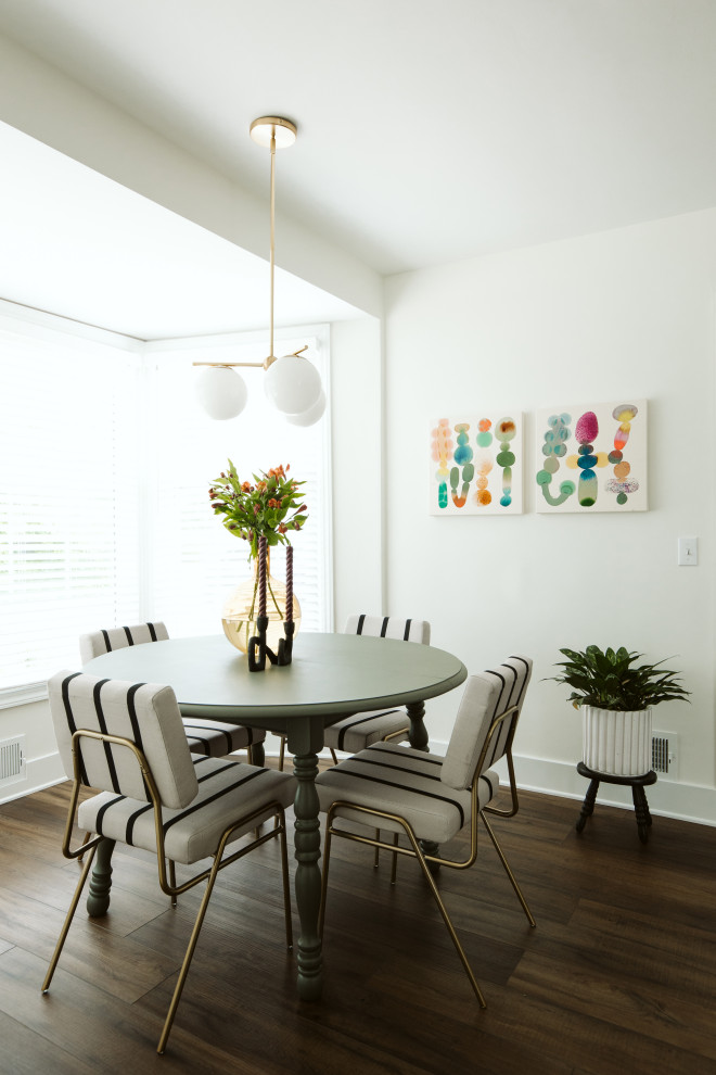 Inspiration for a small traditional separate dining room in Grand Rapids with white walls, vinyl floors, no fireplace and brown floor.