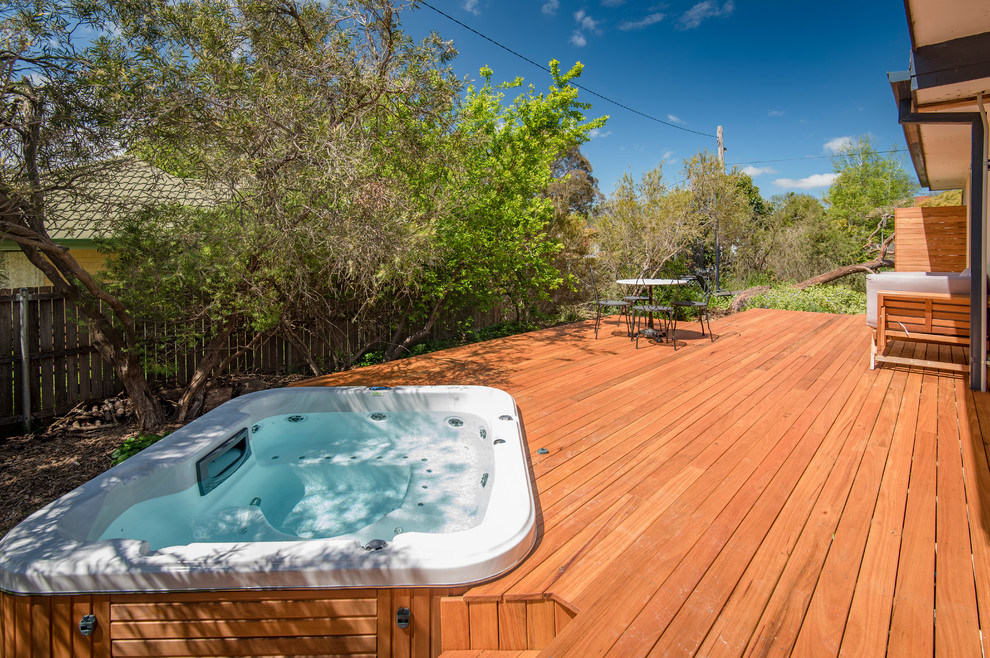 Mid-sized country backyard deck in Canberra - Queanbeyan with no cover.