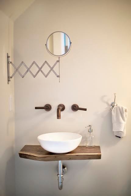 Inspiration for a large transitional cement tile floor and gray floor bathroom remodel in Vancouver with distressed cabinets, a two-piece toilet, white walls, a vessel sink, wood countertops and brown countertops