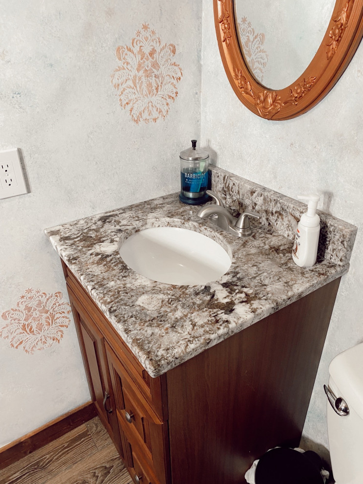 Photo of a small country 3/4 bathroom in Chicago with brown cabinets, grey walls, granite benchtops, white benchtops, a single vanity and a freestanding vanity.