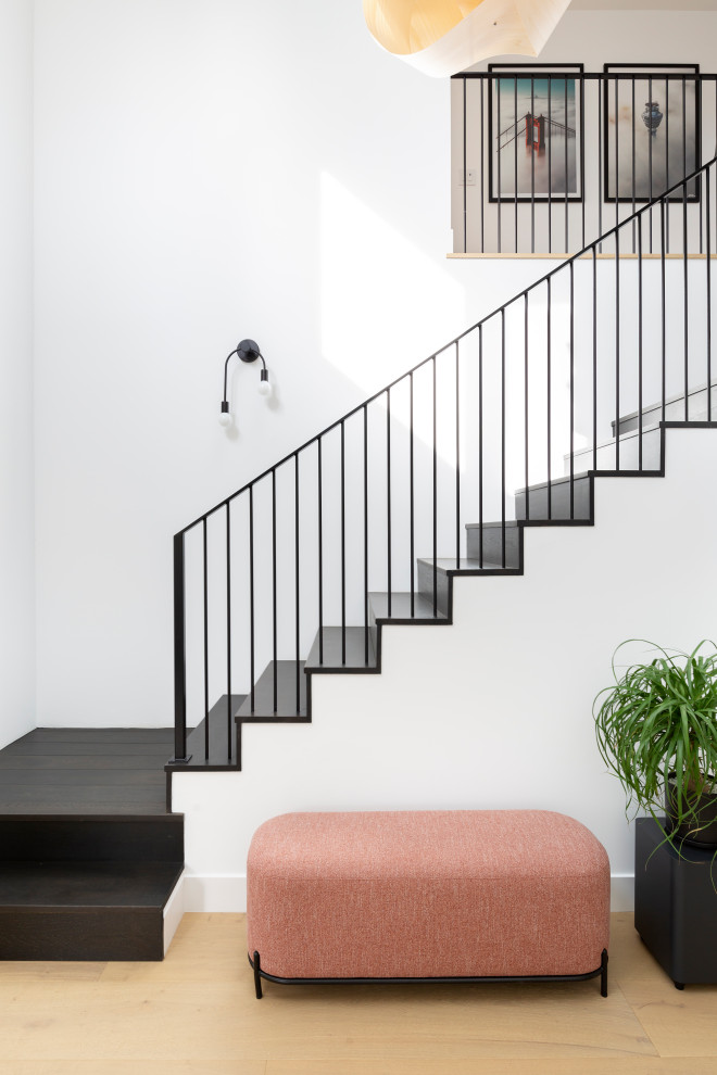 Inspiration for a scandinavian l-shaped metal railing staircase in San Francisco.