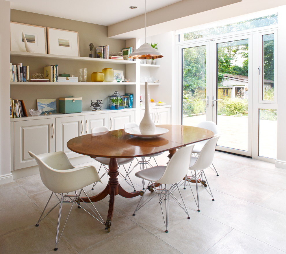 This is an example of a mid-sized transitional dining room in Dublin with beige walls, no fireplace and beige floor.