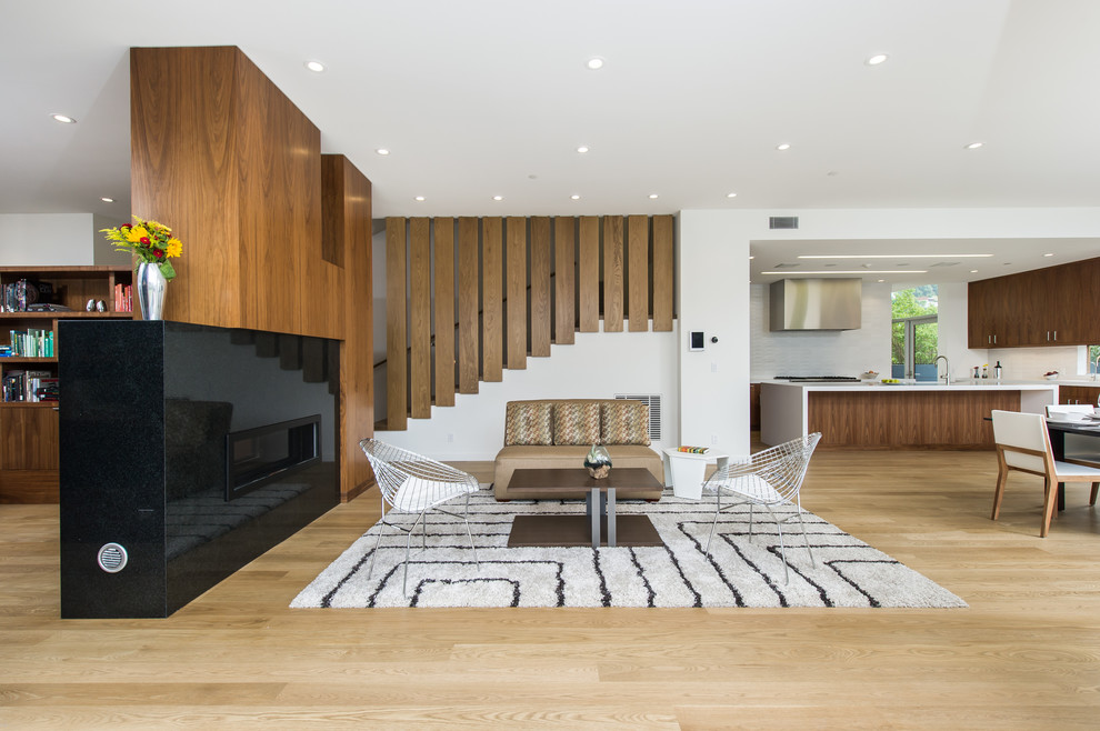 Inspiration for an expansive midcentury formal open concept living room in Los Angeles with white walls, light hardwood floors, a ribbon fireplace, a stone fireplace surround, no tv and beige floor.
