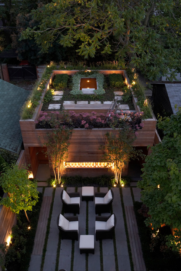 This is an example of a large contemporary rooftop deck in Toronto with a container garden and no cover.