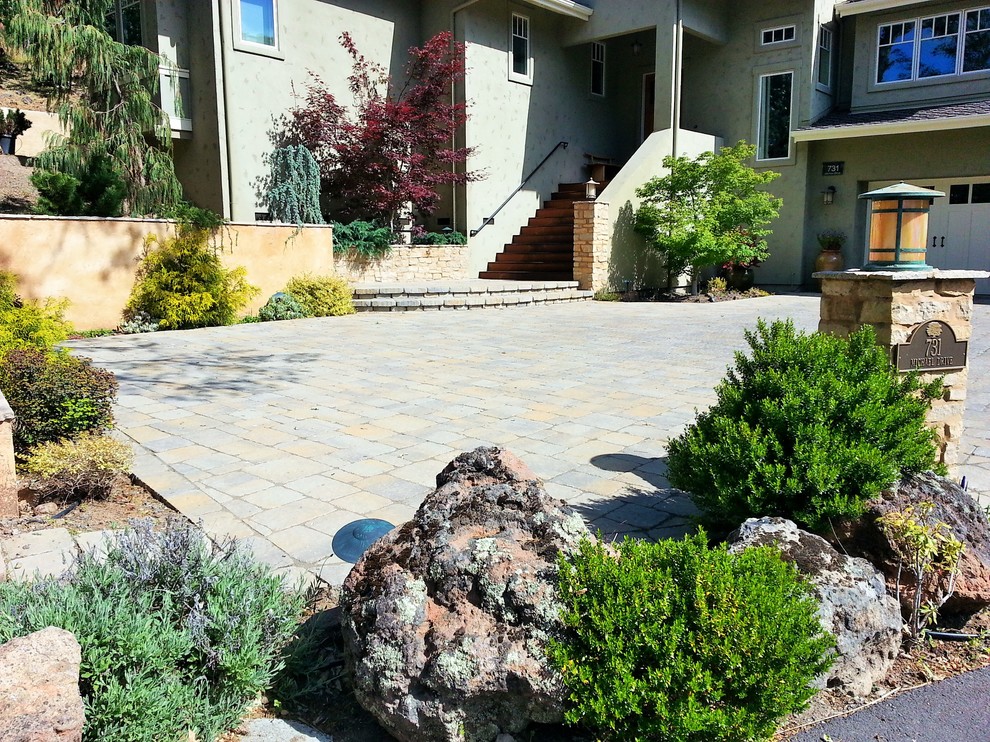 Photo of a mid-sized contemporary front yard full sun driveway in San Francisco with concrete pavers.