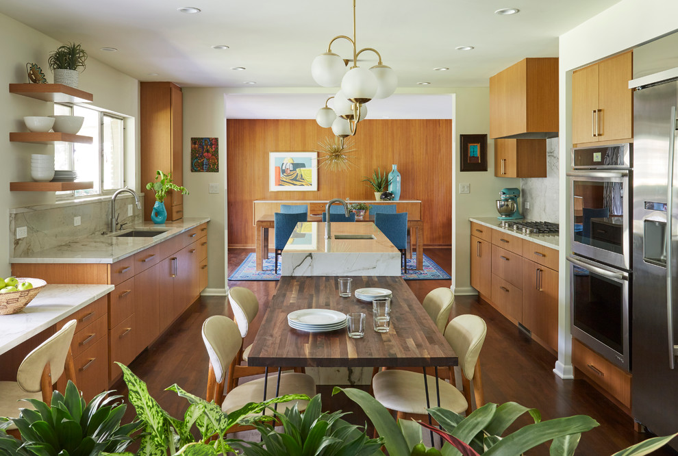 Photo of a midcentury kitchen in Chicago with an undermount sink, flat-panel cabinets, medium wood cabinets, grey splashback, stainless steel appliances and medium hardwood floors.