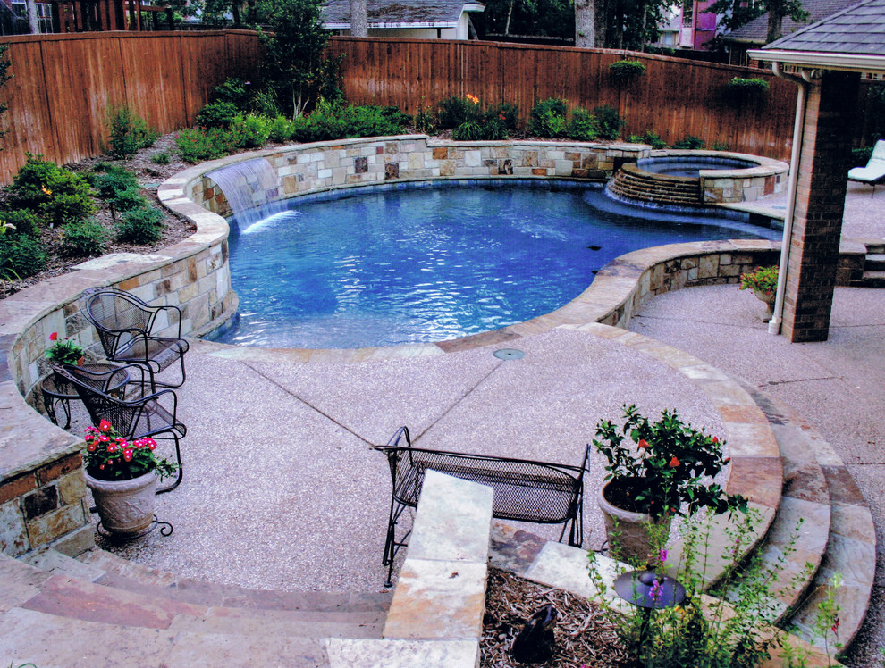 This is an example of a small transitional backyard custom-shaped pool in Dallas.