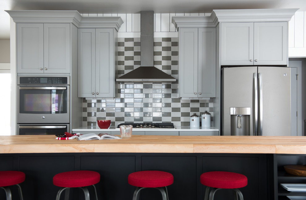 Kitchen - transitional kitchen idea with shaker cabinets, gray cabinets, multicolored backsplash and an island