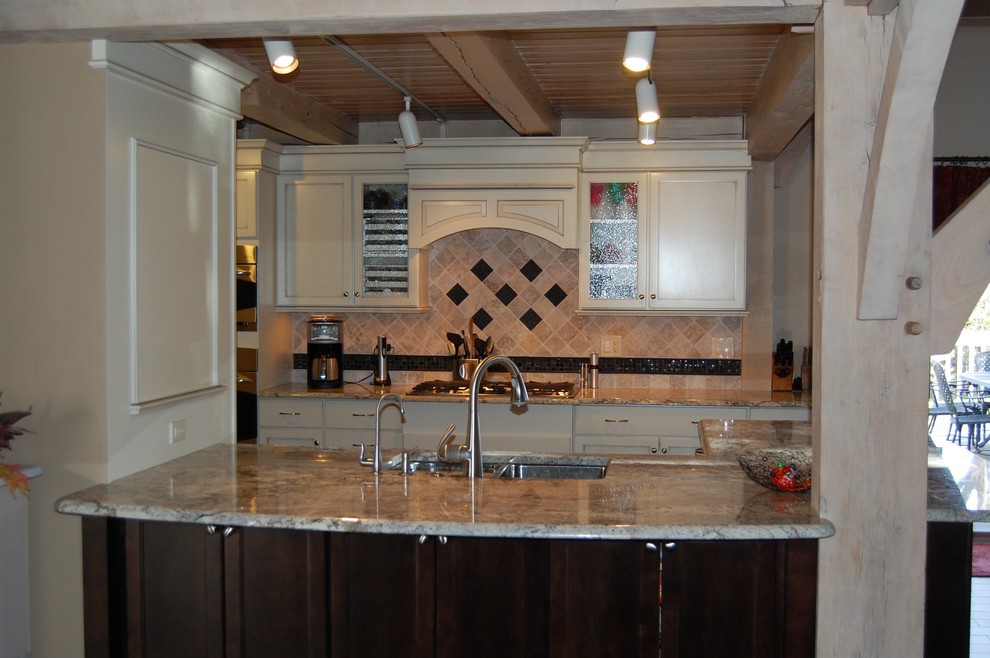 Mid-sized transitional u-shaped medium tone wood floor open concept kitchen photo in Chicago with an undermount sink, flat-panel cabinets, dark wood cabinets, granite countertops, beige backsplash, stone tile backsplash, stainless steel appliances and a peninsula