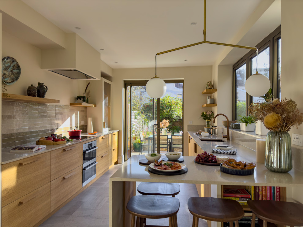 This is an example of a medium sized contemporary kitchen in Other with a breakfast bar.
