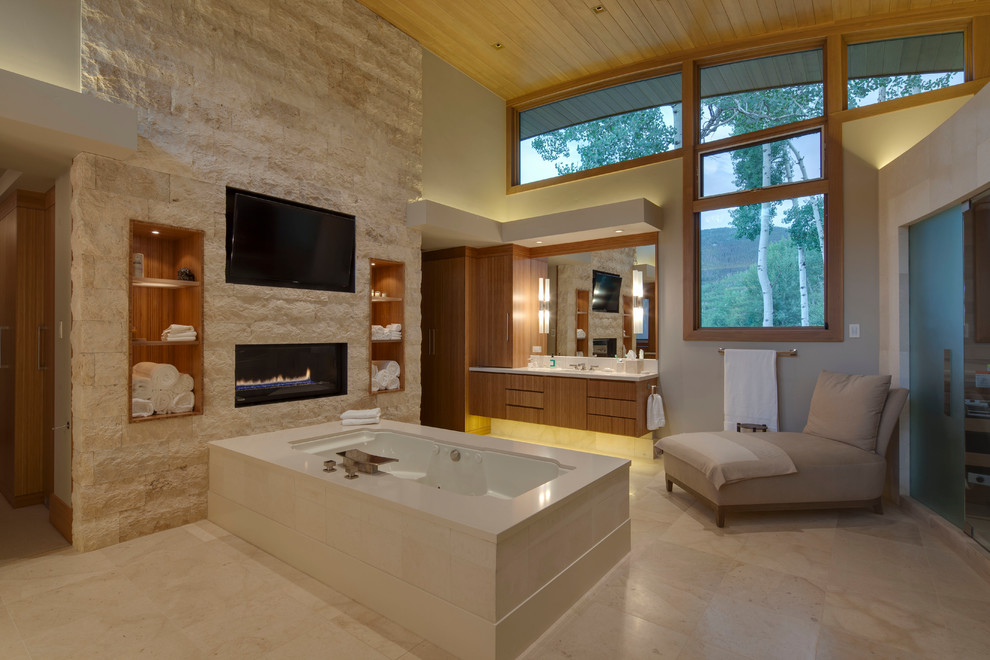 Photo of a contemporary bathroom in Denver with flat-panel cabinets, medium wood cabinets and an undermount tub.