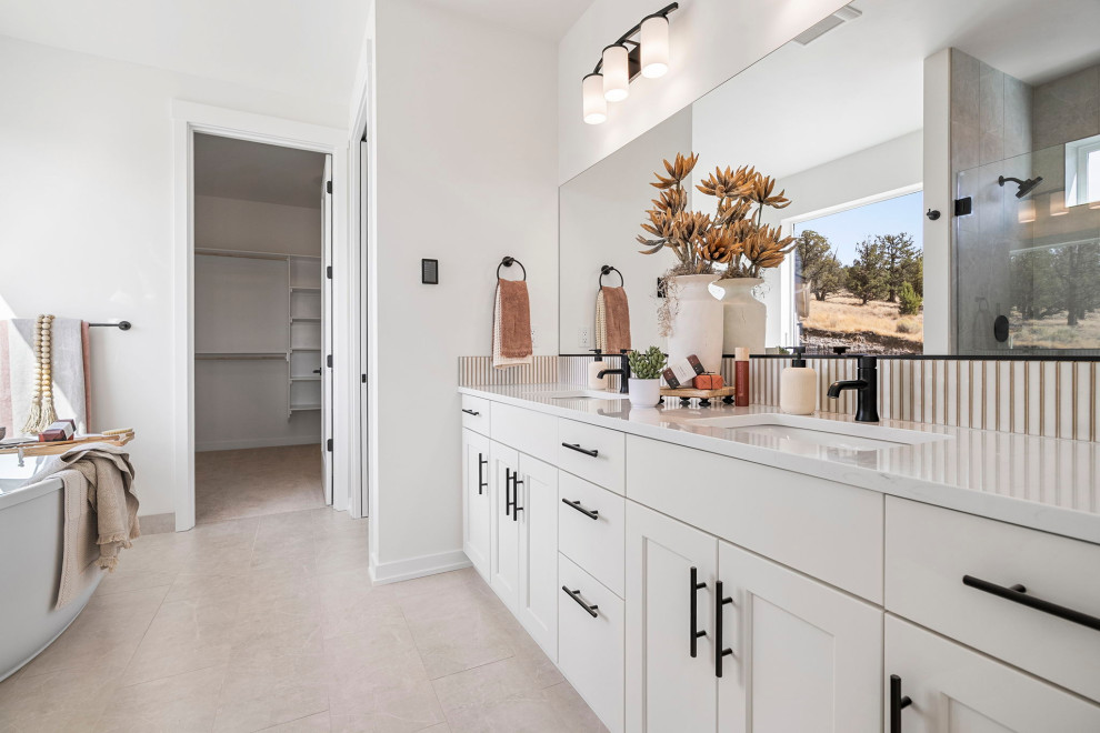 Inspiration for a transitional master double-sink freestanding bathtub remodel