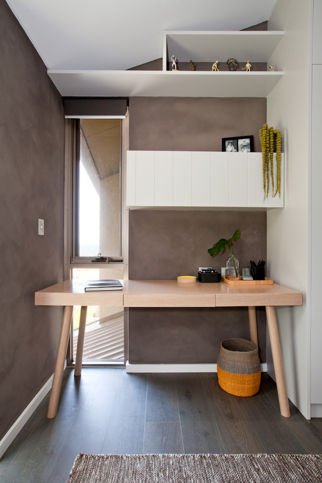 This is an example of a scandinavian home office in Perth with dark hardwood floors.
