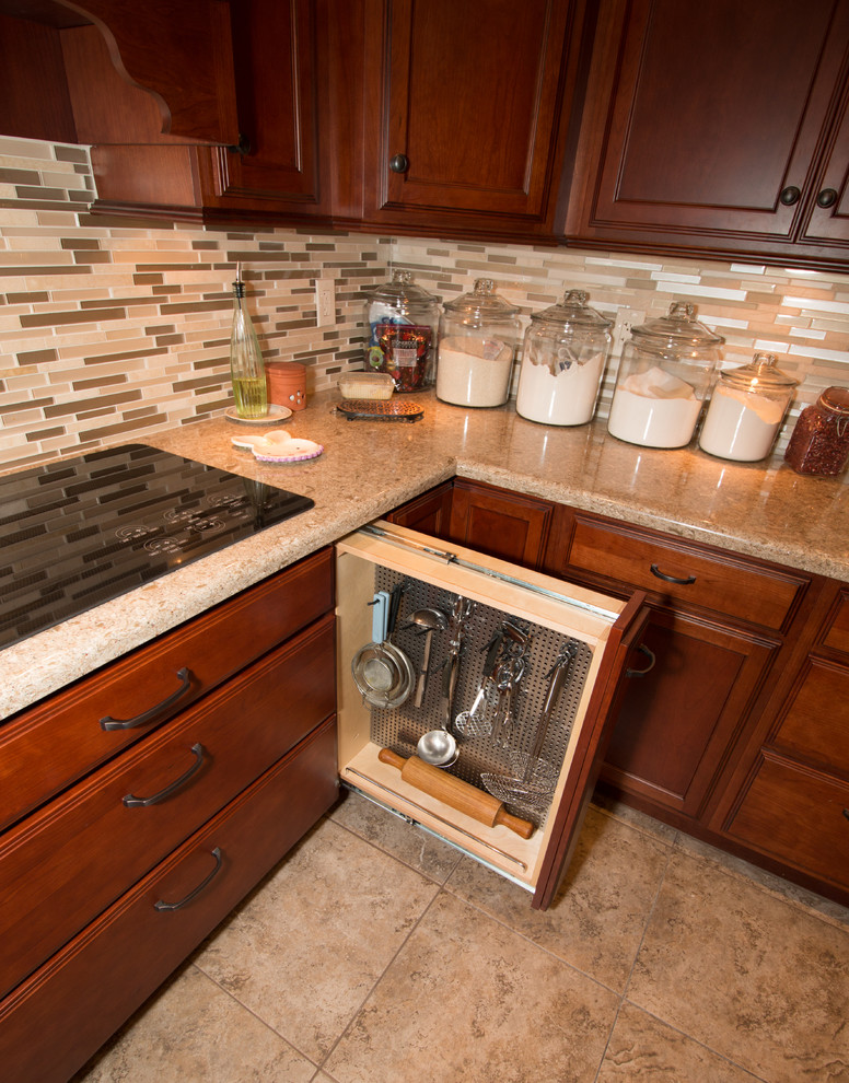 Large transitional u-shaped porcelain tile kitchen photo with an undermount sink, flat-panel cabinets, medium tone wood cabinets, quartz countertops, beige backsplash, mosaic tile backsplash, stainless steel appliances and an island