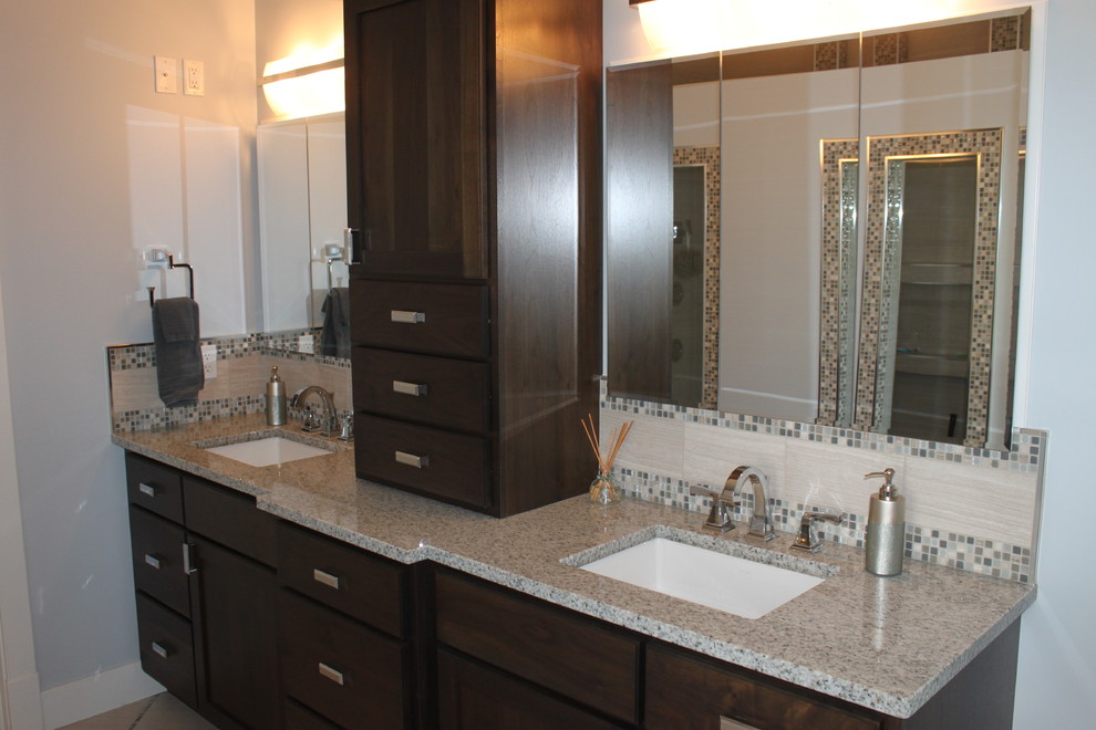 Doorless shower - large transitional master gray tile and porcelain tile porcelain tile doorless shower idea with dark wood cabinets, a two-piece toilet, blue walls, granite countertops and an undermount sink