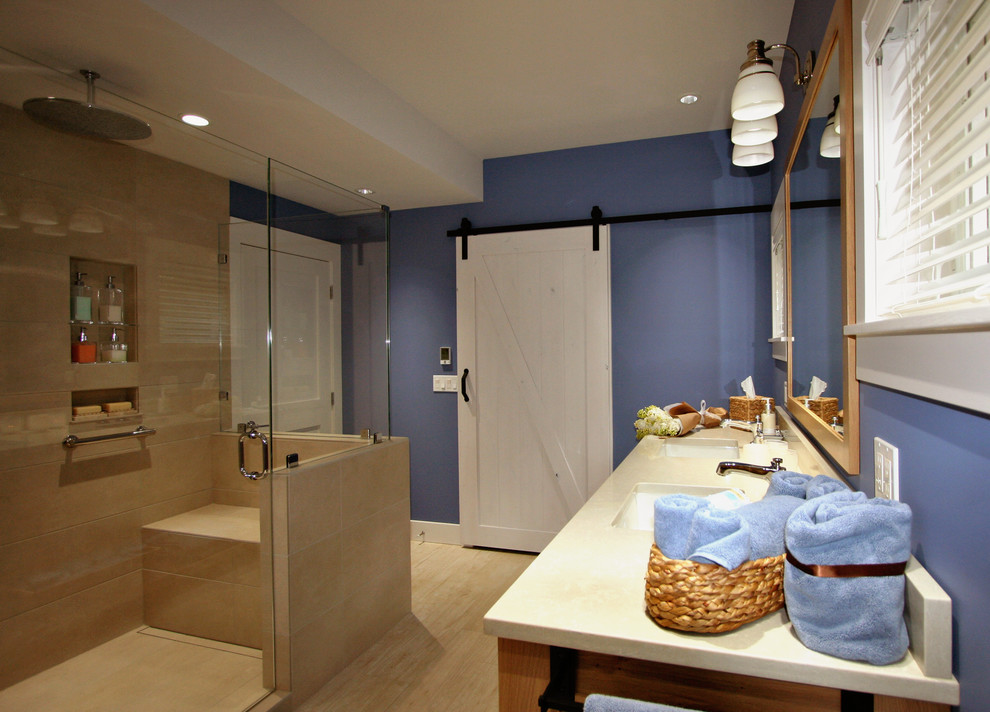 Inspiration for a mid-sized country master wet room bathroom in Seattle with recessed-panel cabinets, light wood cabinets, a one-piece toilet, blue tile, porcelain tile, blue walls, porcelain floors, an undermount sink, engineered quartz benchtops and grey floor.