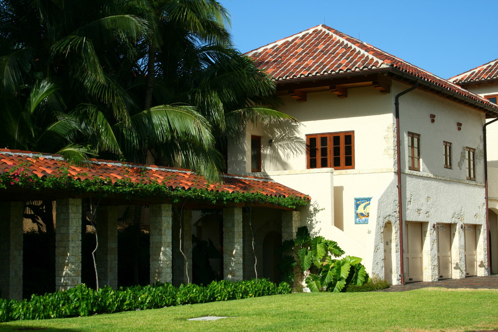 This is an example of a mediterranean two-storey exterior in Miami.