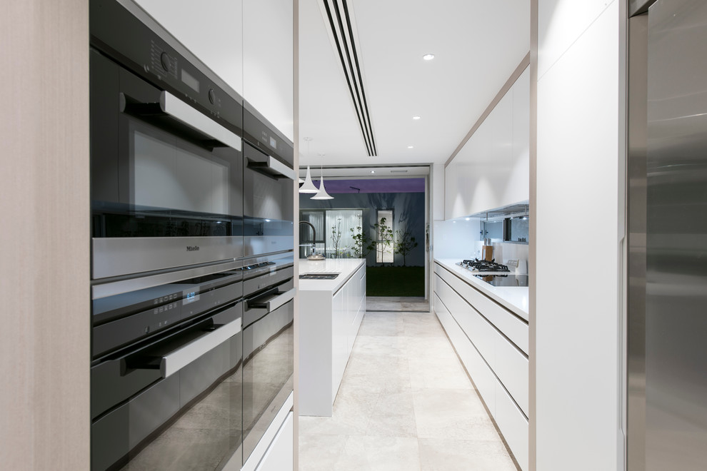 This is an example of a large contemporary galley eat-in kitchen in Perth with flat-panel cabinets, white cabinets and with island.
