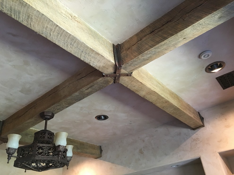 Inspiration for a rustic built-in desk home design remodel in Austin with beige walls
