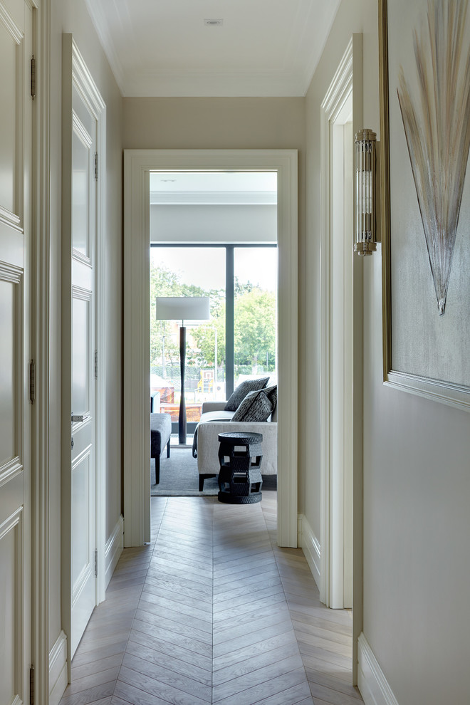 Inspiration for a transitional hallway in Moscow with beige walls and light hardwood floors.