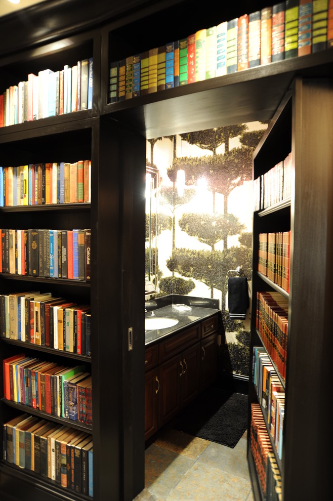 Example of a trendy bathroom design in St Louis with raised-panel cabinets and dark wood cabinets