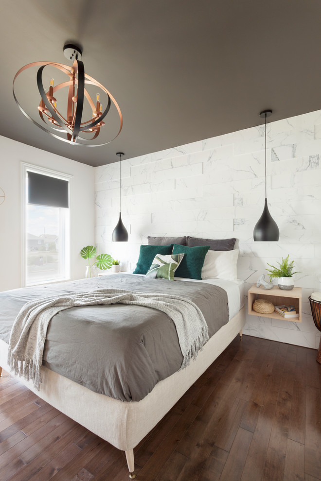 Design ideas for a mid-sized contemporary master bedroom in Montreal with white walls, dark hardwood floors and brown floor.