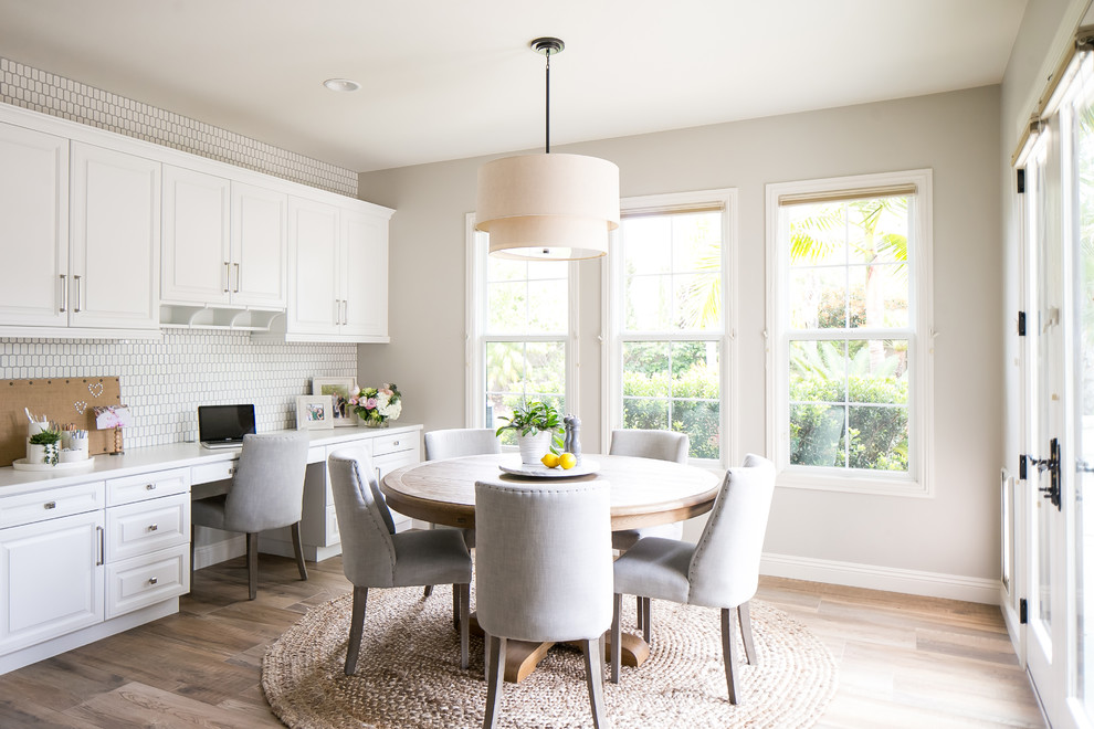 Transitional kitchen/dining combo in San Diego with grey walls, dark hardwood floors and brown floor.