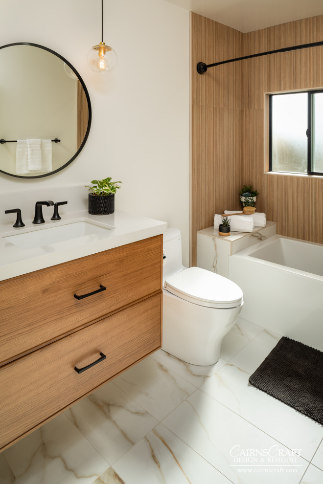 This is an example of a medium sized ensuite bathroom in San Diego with white cabinets, a shower/bath combination, a two-piece toilet, beige tiles, white walls, an integrated sink, engineered stone worktops, white floors, white worktops, a wall niche, a single sink, a floating vanity unit, flat-panel cabinets, an alcove bath, wood-effect tiles, porcelain flooring and an open shower.