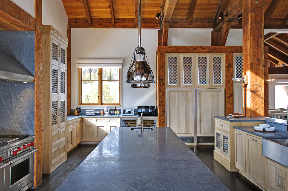 Inspiration for a country kitchen in New York with a farmhouse sink and stainless steel appliances.