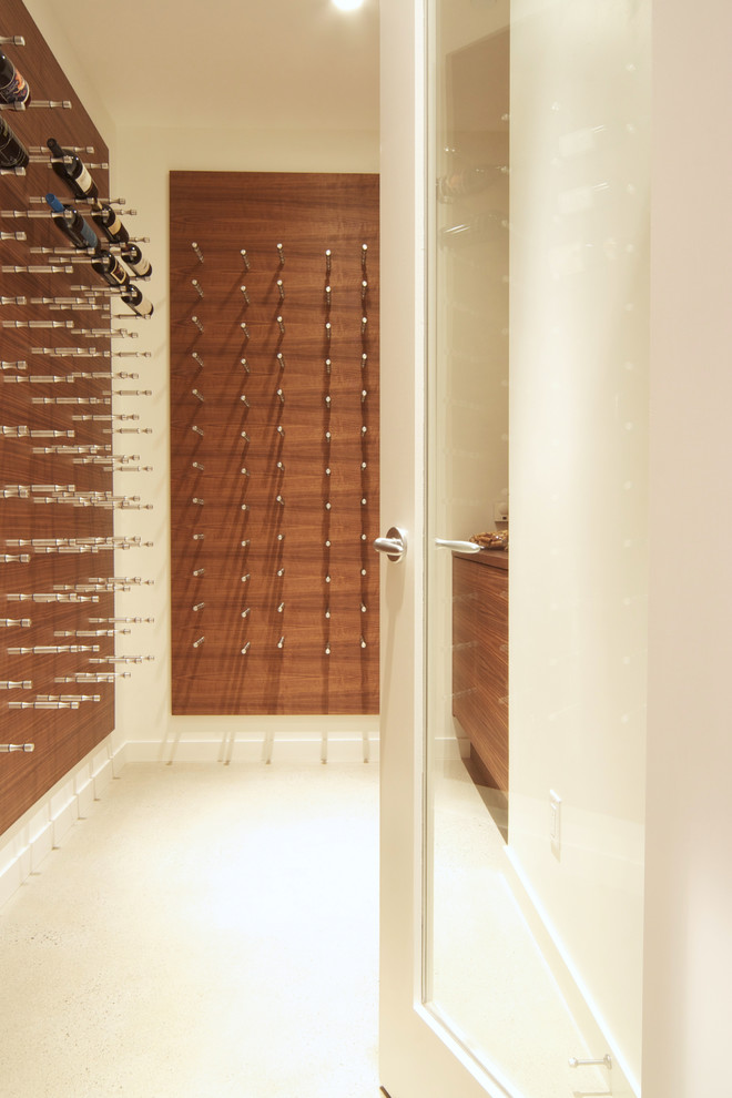 Design ideas for a mid-sized modern wine cellar in Vancouver with storage racks.