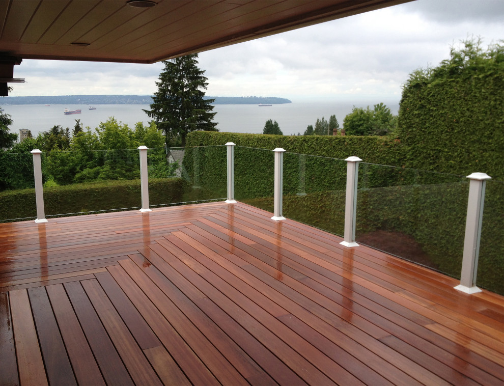 Deck - mid-sized transitional backyard deck idea in Calgary