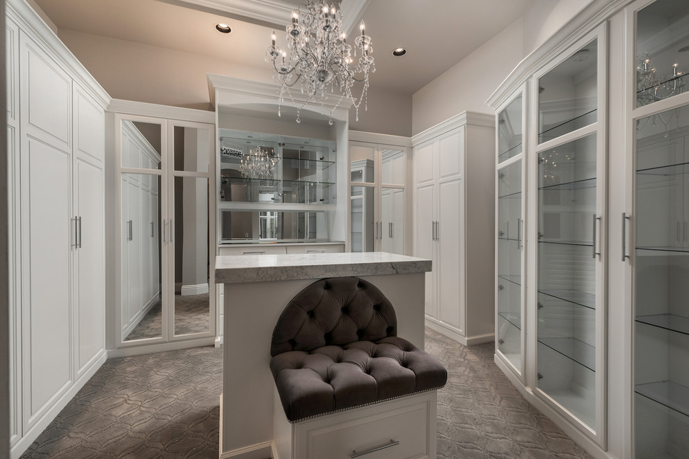 Design ideas for an expansive mediterranean gender-neutral walk-in wardrobe in Phoenix with glass-front cabinets, white cabinets, carpet, grey floor and coffered.