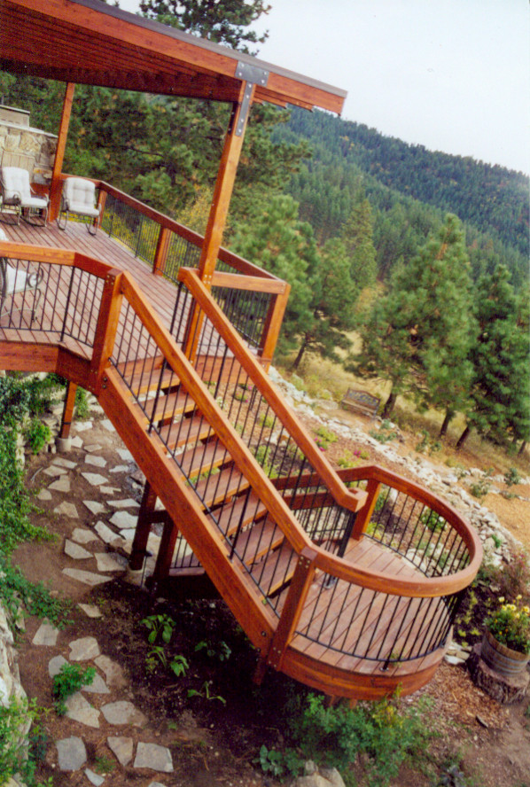 Photo of a mid-sized traditional wood curved staircase in Seattle with wood risers.