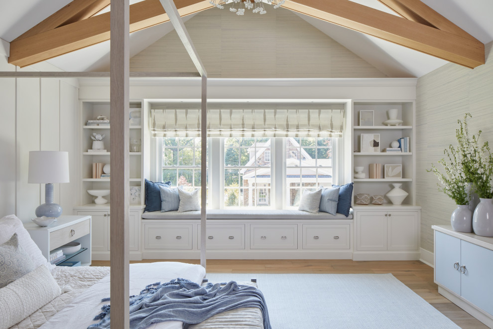 Design ideas for a large classic master bedroom in New York with white walls, medium hardwood flooring, brown floors, exposed beams and panelled walls.