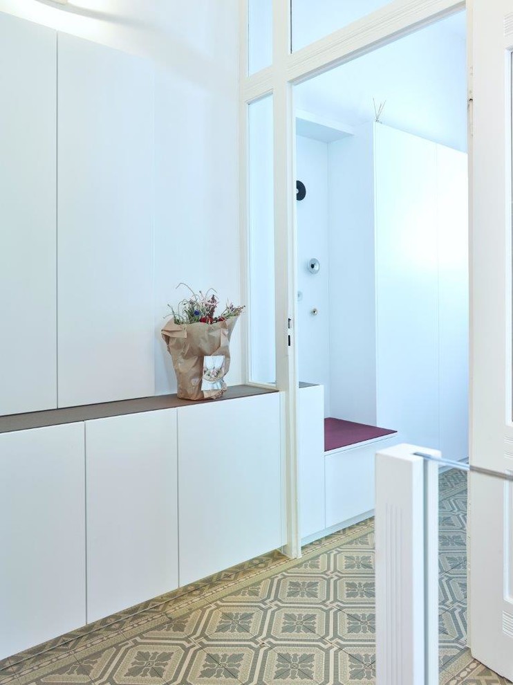 Inspiration for a large contemporary hallway in Stuttgart with terrazzo floors and multi-coloured floor.