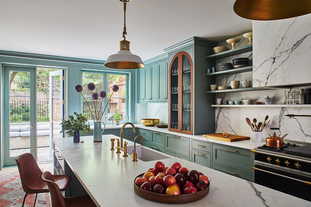 This is an example of a transitional eat-in kitchen in New York with with island.