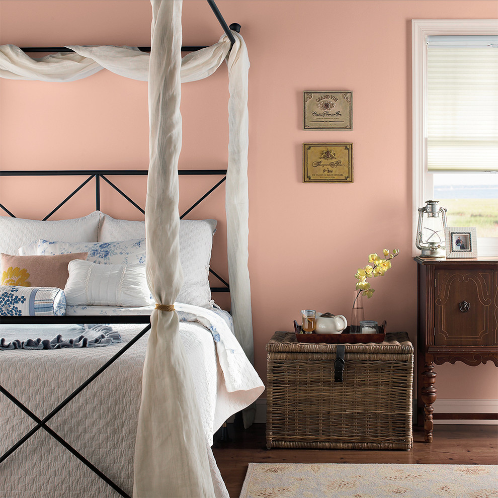 Inspiration for a traditional bedroom in Orange County with pink walls.