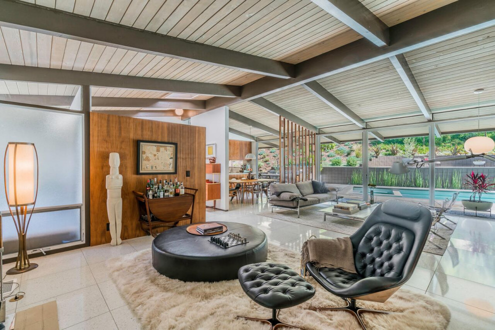 Photo of a mid-sized midcentury open concept living room in Los Angeles with exposed beam.