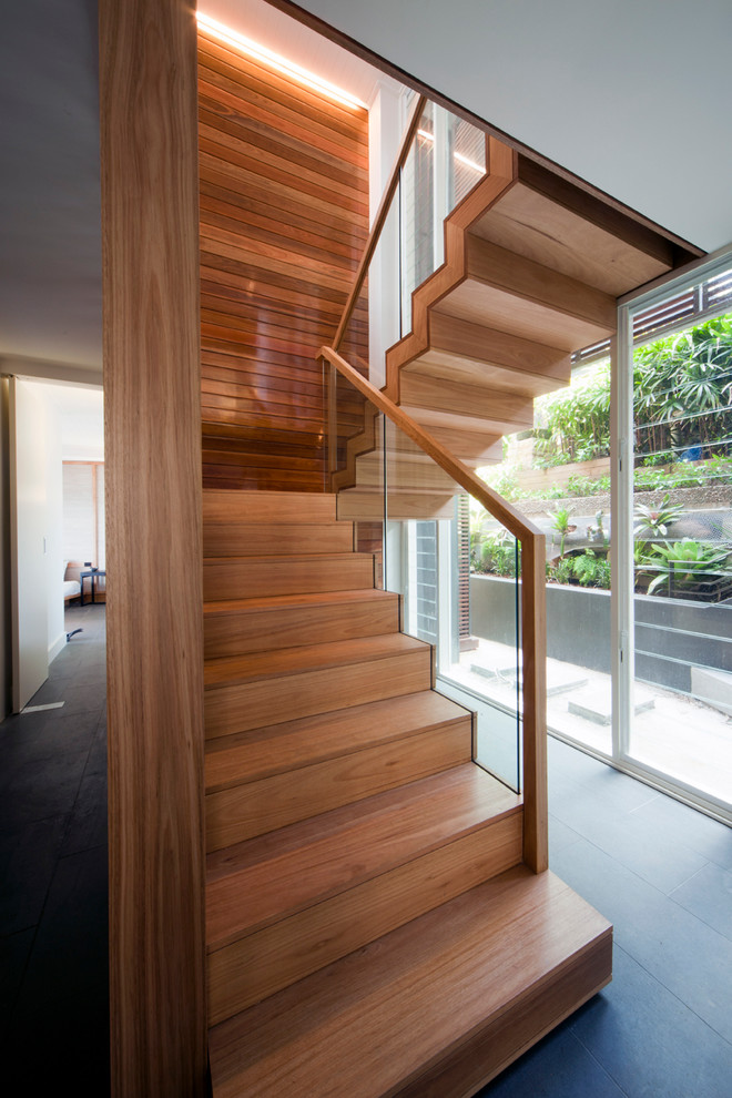 Inspiration for a contemporary wood staircase in Sydney with wood risers.