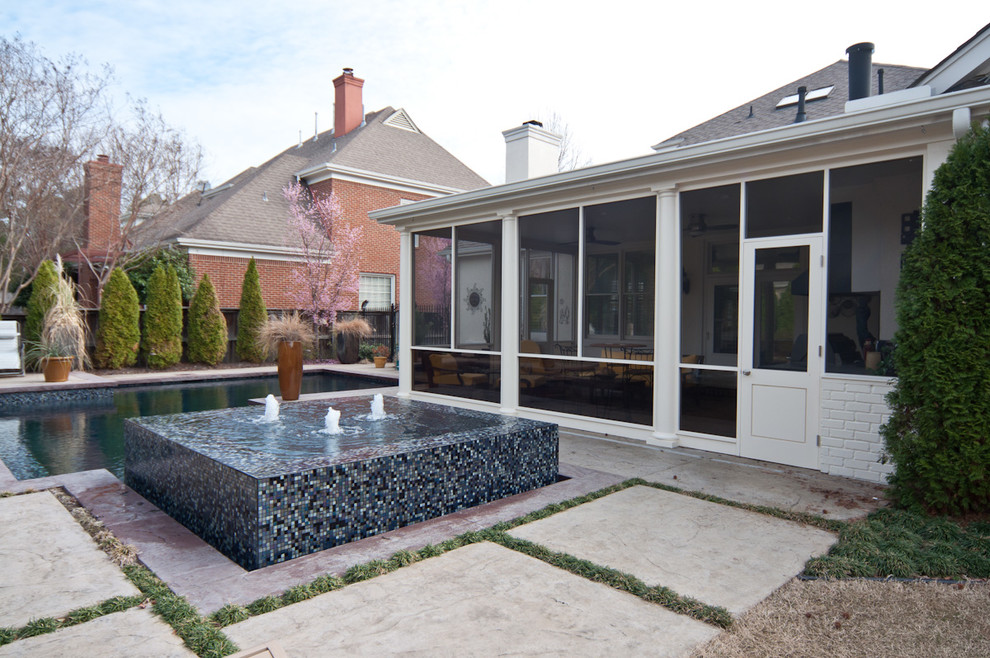 Pool fountain - mid-sized backyard concrete paver and l-shaped natural pool fountain idea