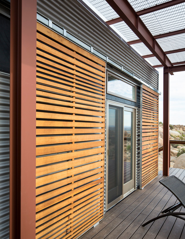 Inspiration for a large contemporary one-storey brown exterior in Los Angeles with wood siding.